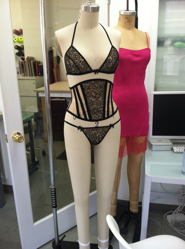 In front: the Margo bralet, waspie, and panty from S/S'14. Behind: the Holly silk full slip from Holiday '13/'14